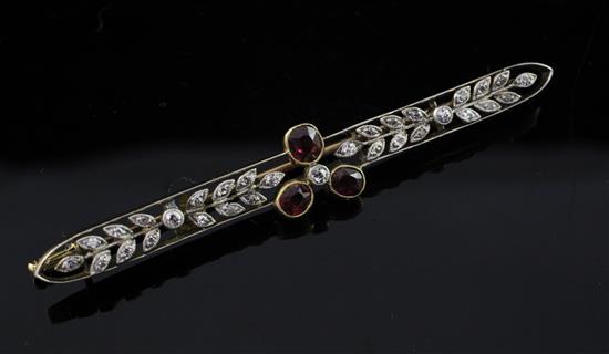 A Belle Epoque gold, garnet and old cut diamond set bar brooch, 2.5in.